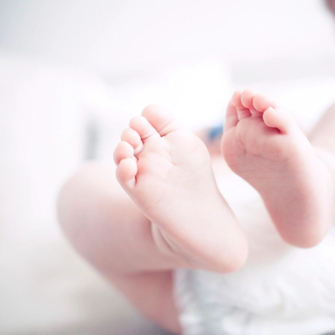 closeup shot of the feet of a newborn baby